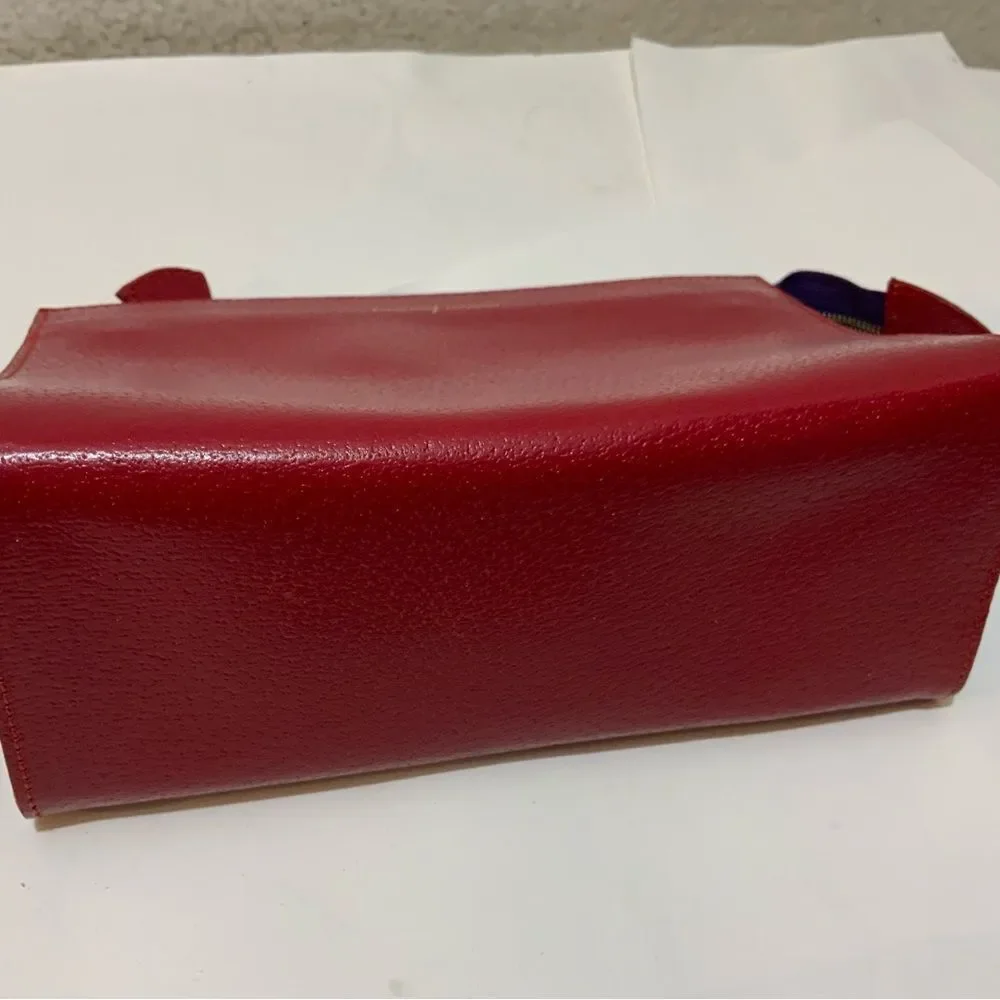 NWOT Aspinal of London red reptile cosmetic case.